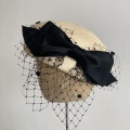 straw beret hat with black bow Holly Young