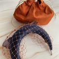 navy and rusty orange bag and headband
