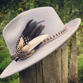 Black and gold clip styled on a hat