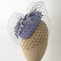 Blue occasion hat with navy veiling