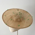 sand coloured boater with green spots
