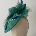 Emerald green disk hat with tulle