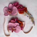Pink floral hair vine and corsage for a bride