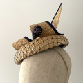 Straw hat with vintage hat pin