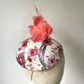 silk patterned hatinator with coral feathers