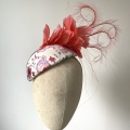 Striking coral hat for mother of the bride