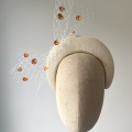 Ivory headband fascinator with peaches Ivory headband fascinator with peaches