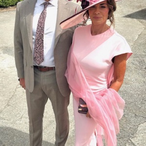large pink and burgundy hat with sweeping brim