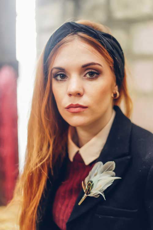 silk headscarf in black with mint green feather brooch