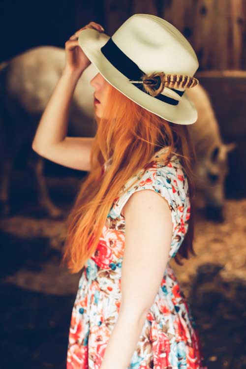 Panama hat with pheasant feather brooch