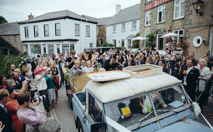 crowd around bride and groom 