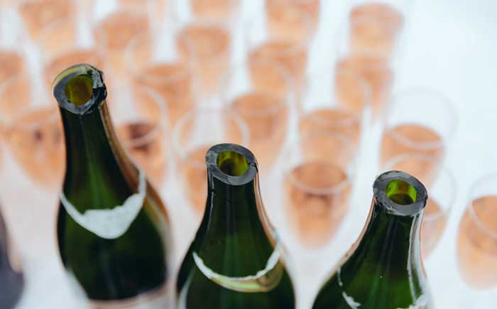 pink bubbly on ice at wedding reception