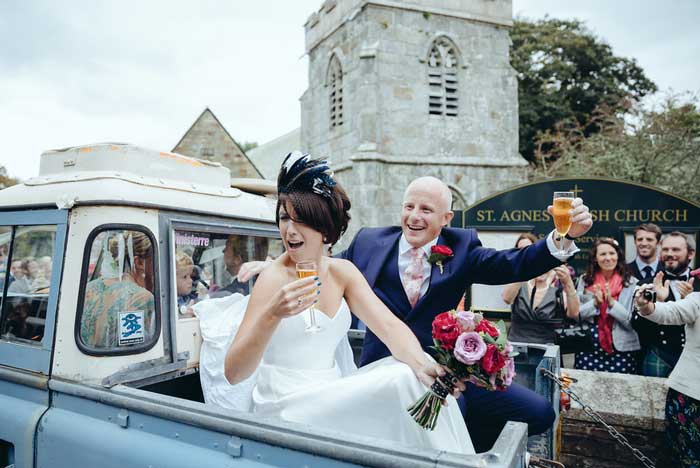 bride and groom leave the church